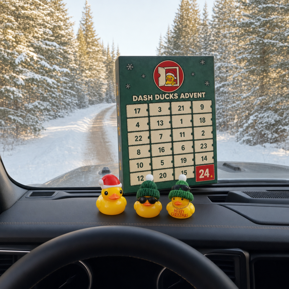 Dash Ducks Advent calendar on a Jeep dashboard with three Christmas rubber ducks